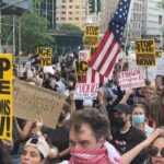 Love and Defiance: NYC Protesters Stand Strong for America’s Greatness